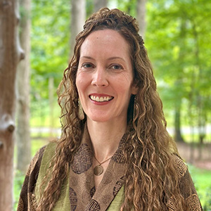 smiling woman with long dark hair