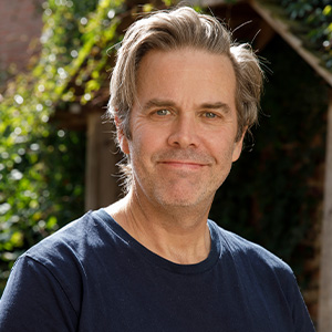 smiling man in dark t-shirt